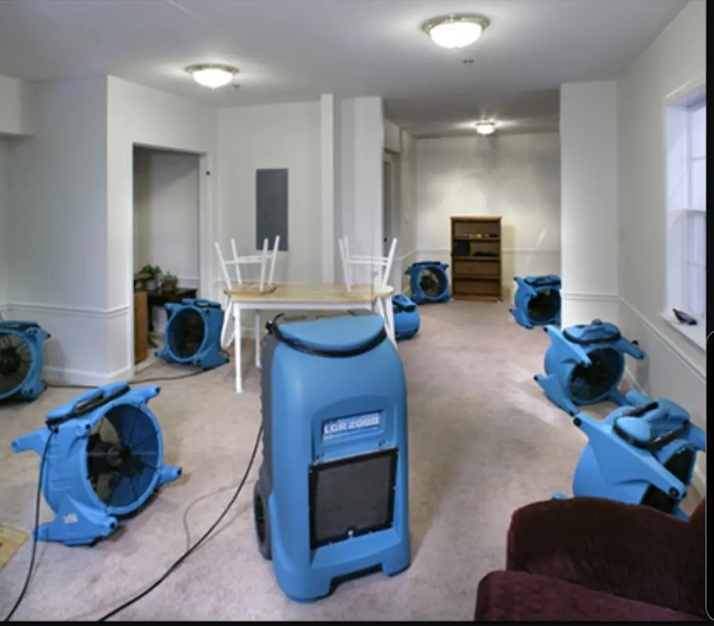 Air movers and dehumidifier setup for Water Damage Restoration in Dyer